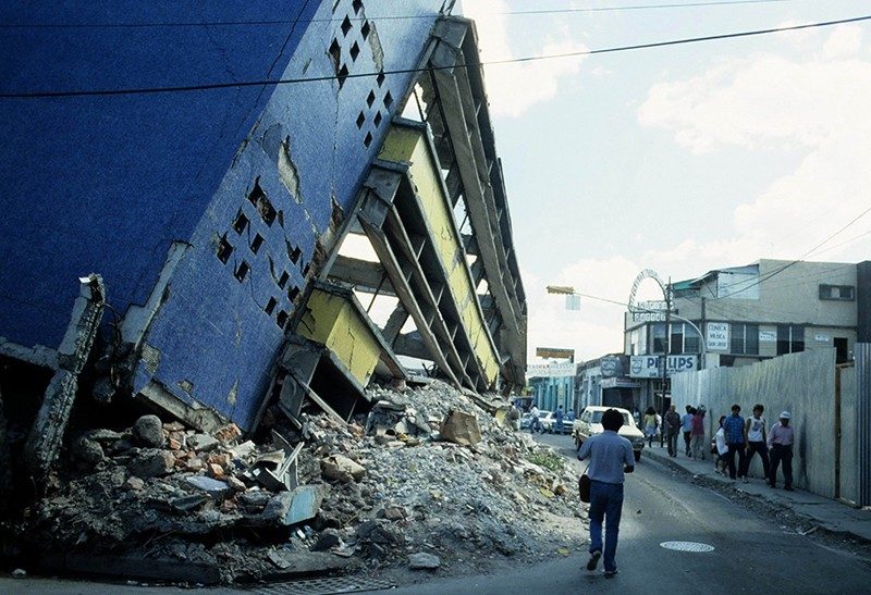 Picture shows destroyed houses.