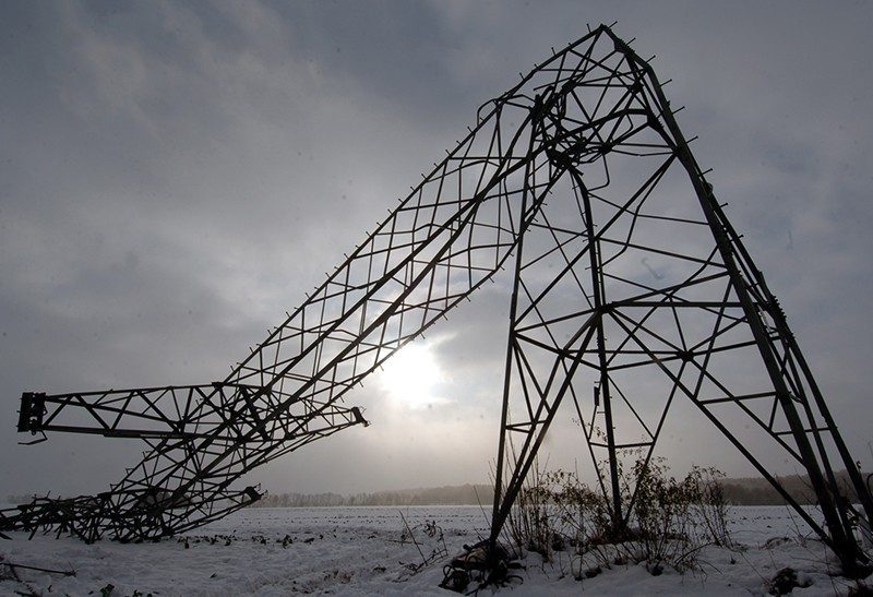 Picture shows a bent power pole.